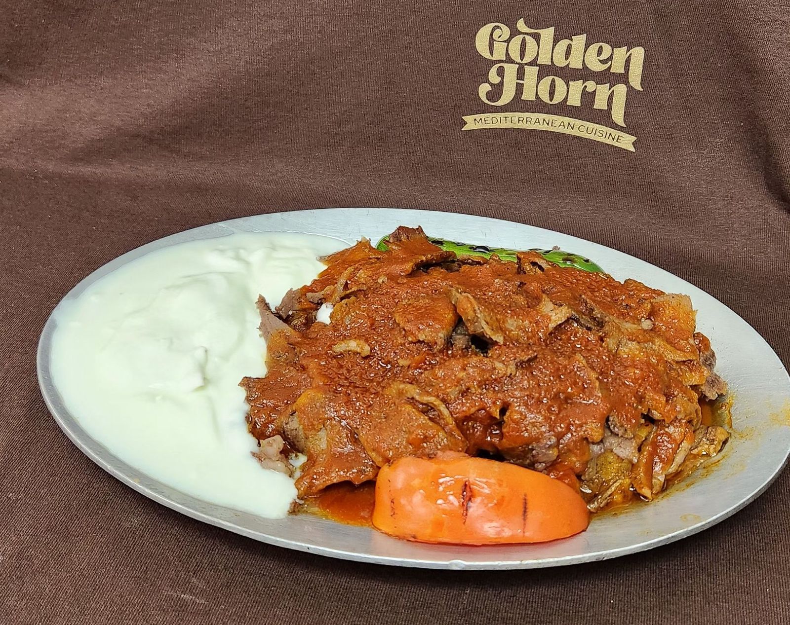 Iskender kebab with tomato sauce and yogurt