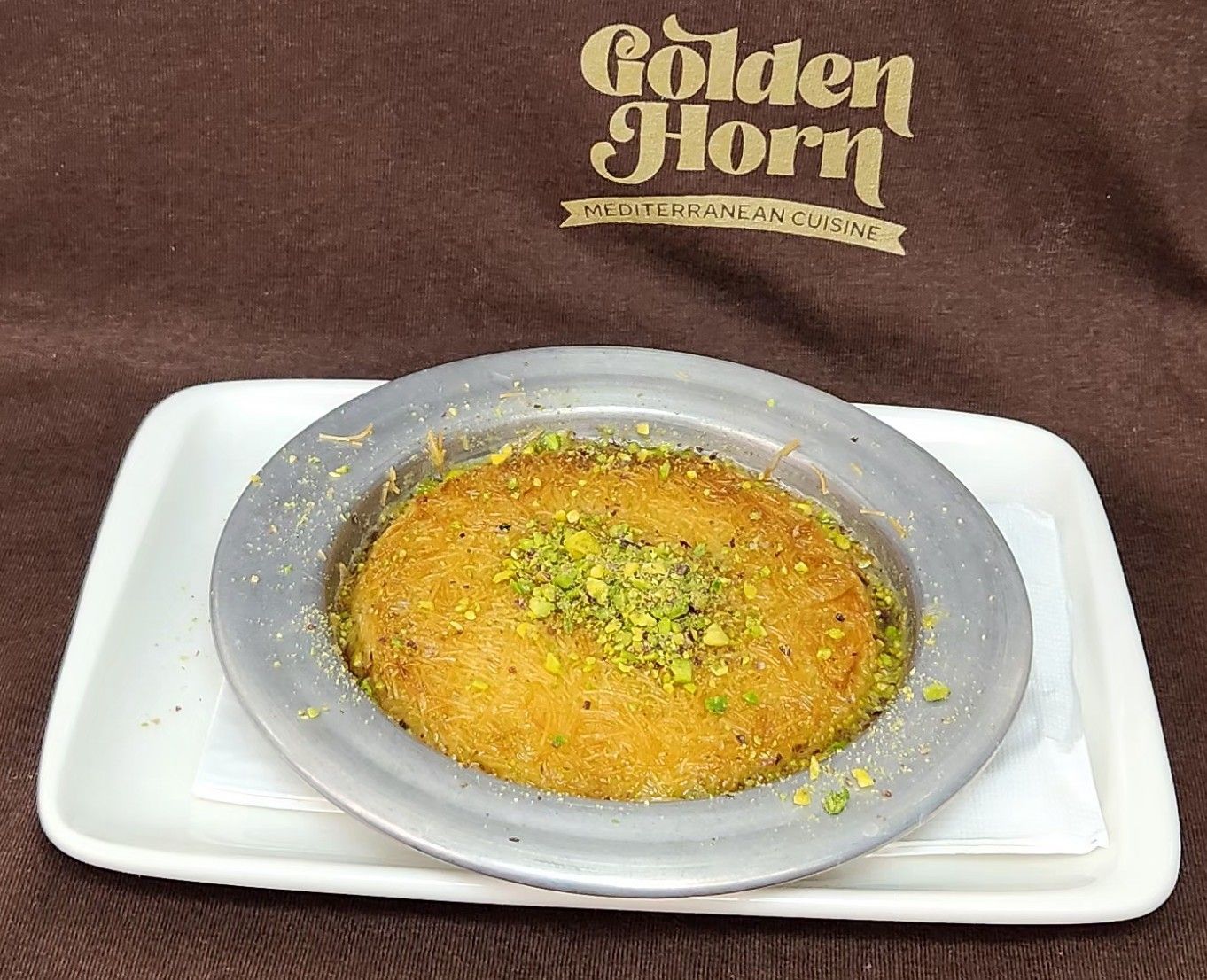 Künefe topped with pistachio