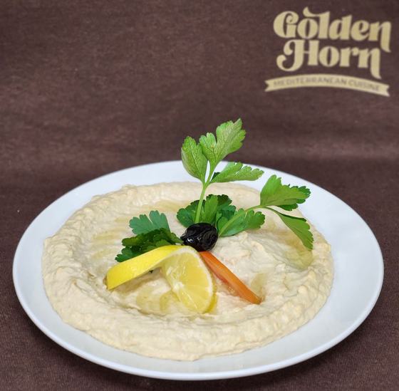 A cold dip with lemon, olive and parsley
