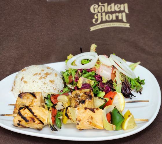 Grilled skewers with rice and salad