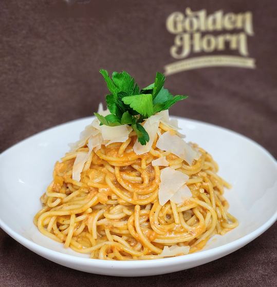 Spaghetti with shaved parmesan