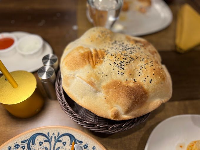 Balon lavas, a puffed-up balloon bread, at the table